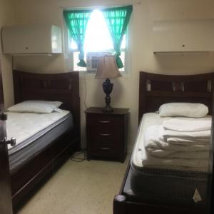 Two beds and sheets for Warwick Camp Barracks Officers Quaters